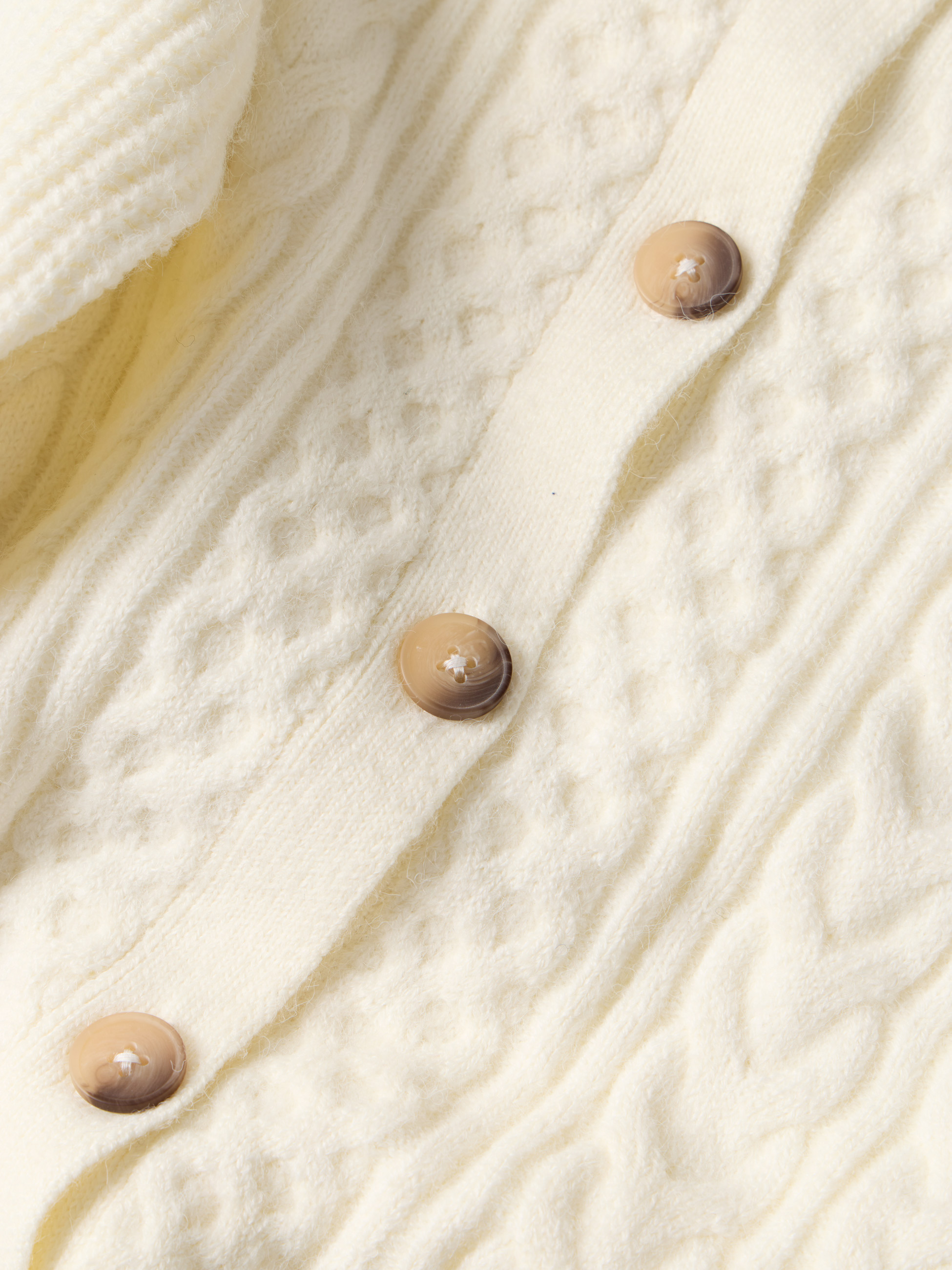 Casaco de malha entrançada