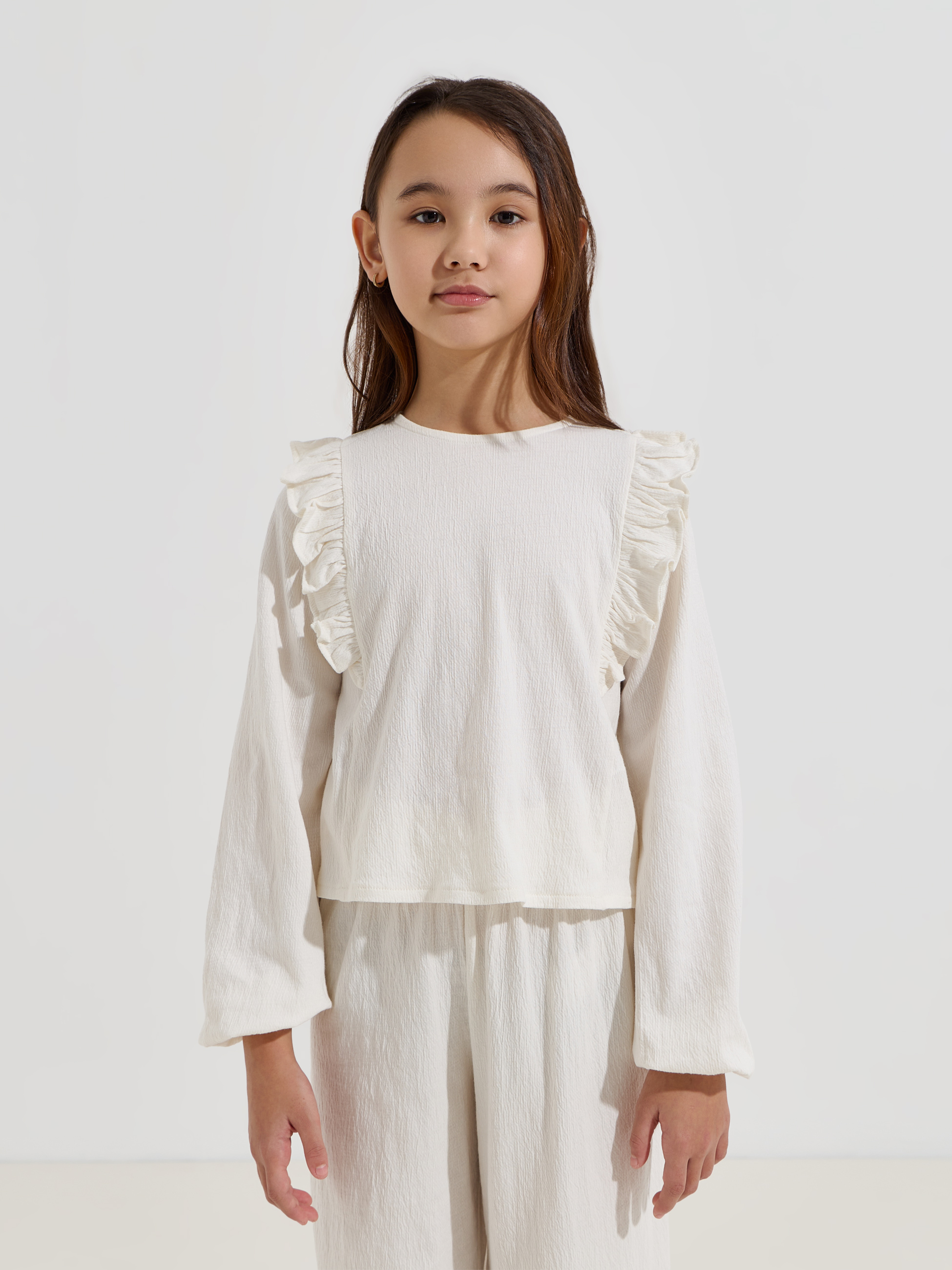 Blusa com folhos nos ombros