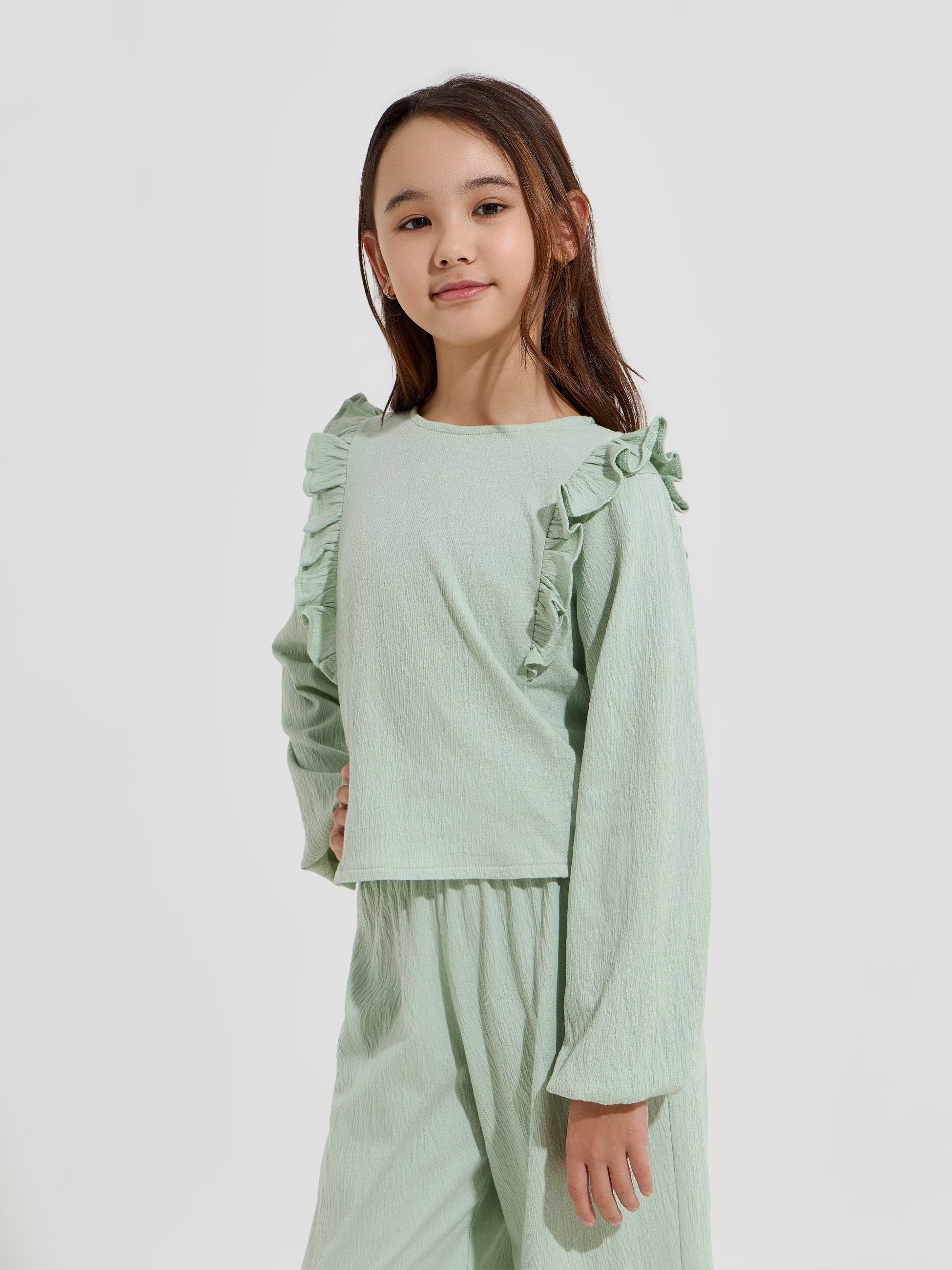 Blusa com folhos nos ombros
