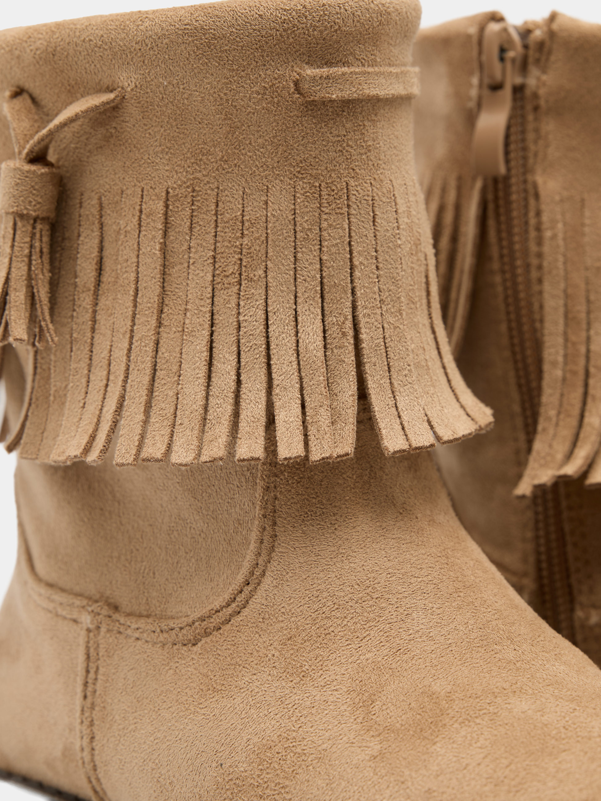 Botas com franjas