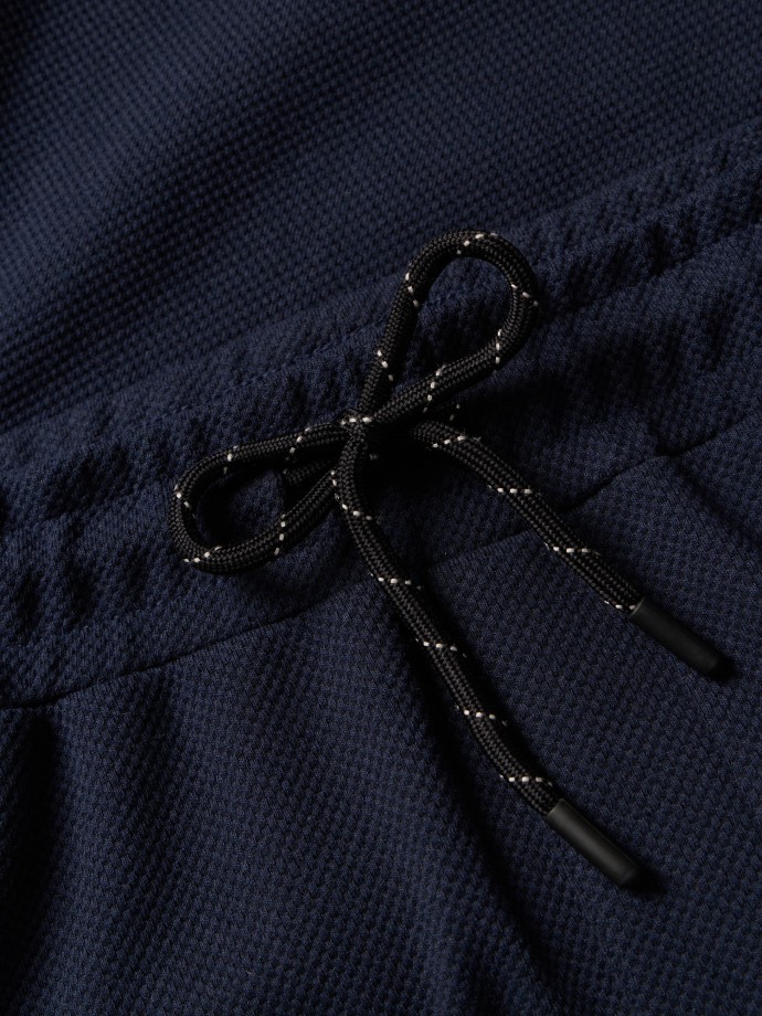 Cal�as em malha piquet