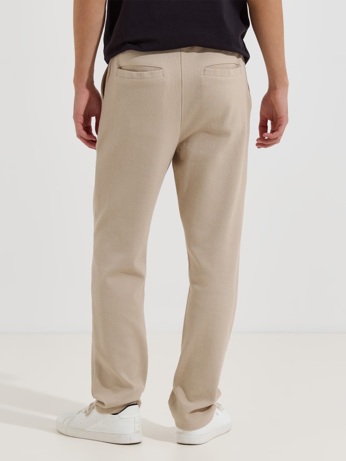 Cal�as em malha piquet