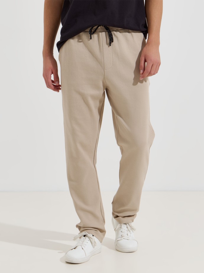 Cal�as em malha piquet