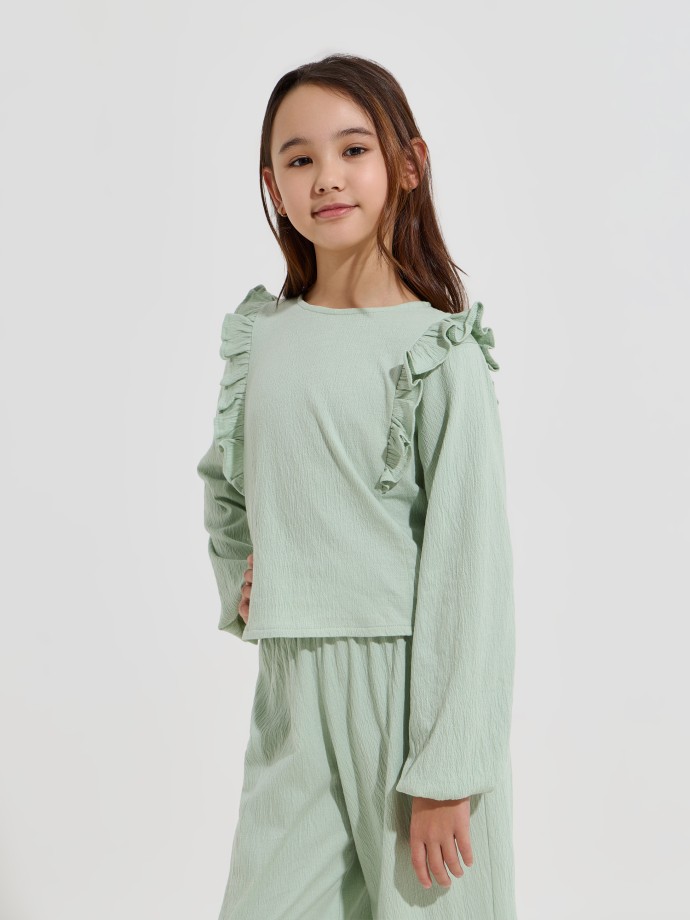 Blusa com folhos nos ombros