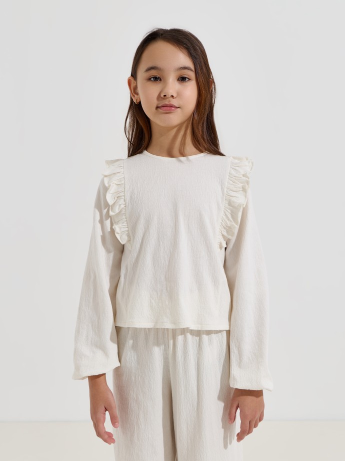 Blusa com folhos nos ombros