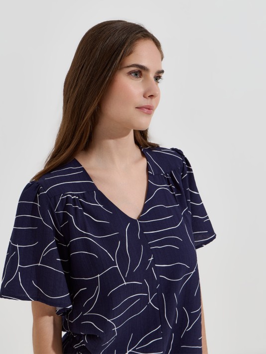 Blusa flu�da estampada decote em V