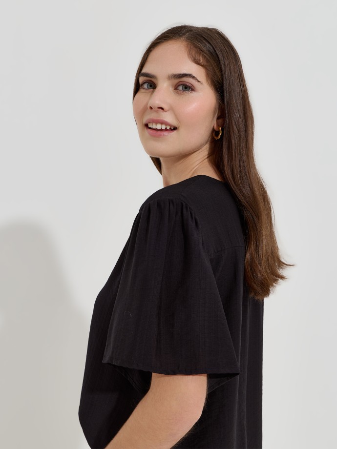 Blusa flu�da estampada decote em V