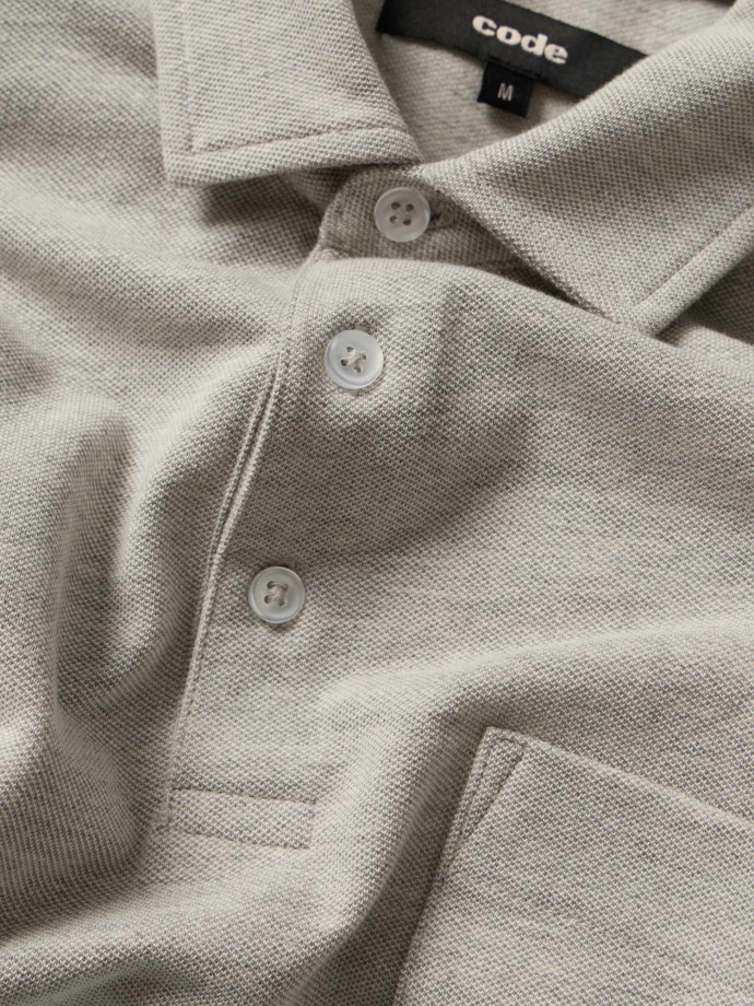 Polo bicolor com bolso