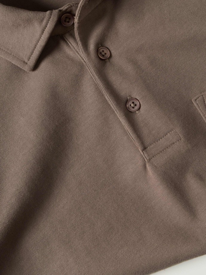 Polo de manga comprida com bolso